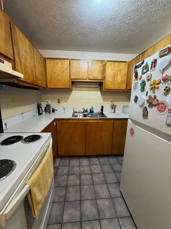 a bathroom with a toilet and a shower curtain