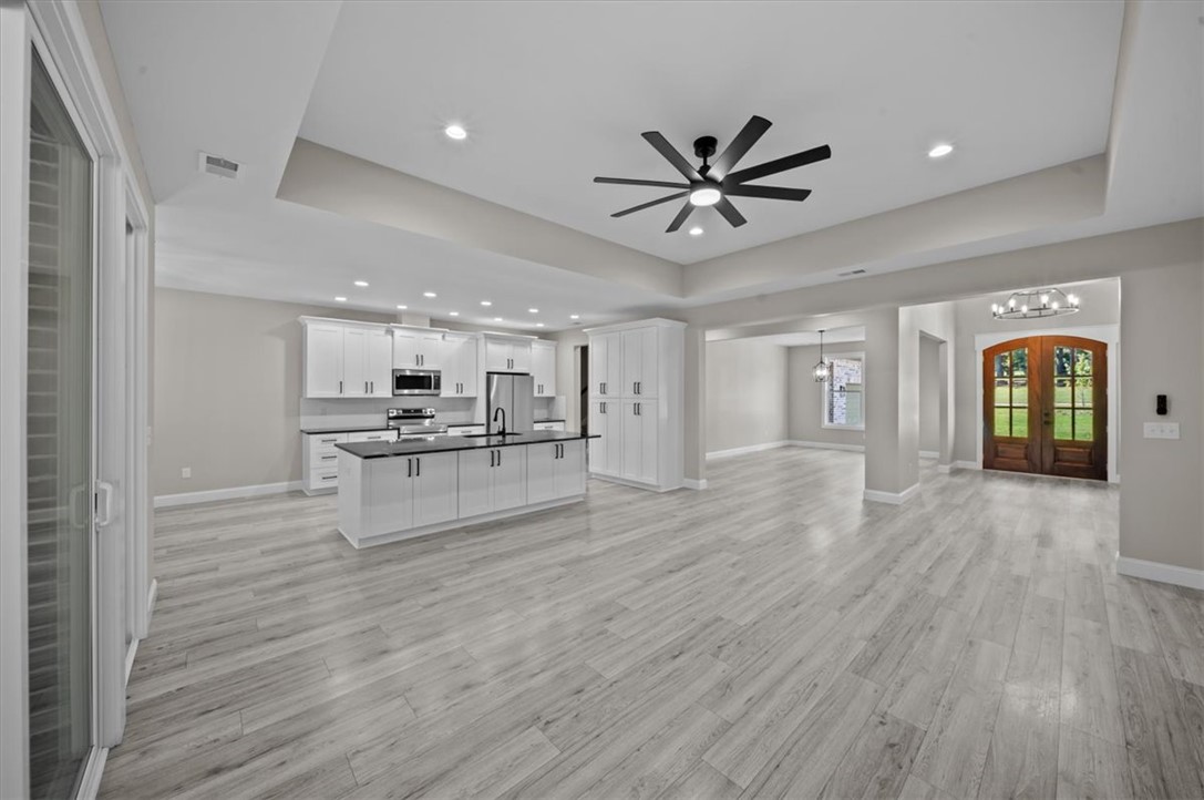 105 Bree Drive Anderson, SC 29621 - Photo 10 of 48 An open-concept living space with a contemporary kitchen and inviting entry welcomes residents home.