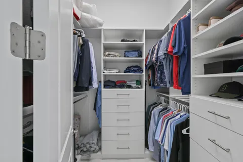 a view of washer and dryer with kitchen in the background