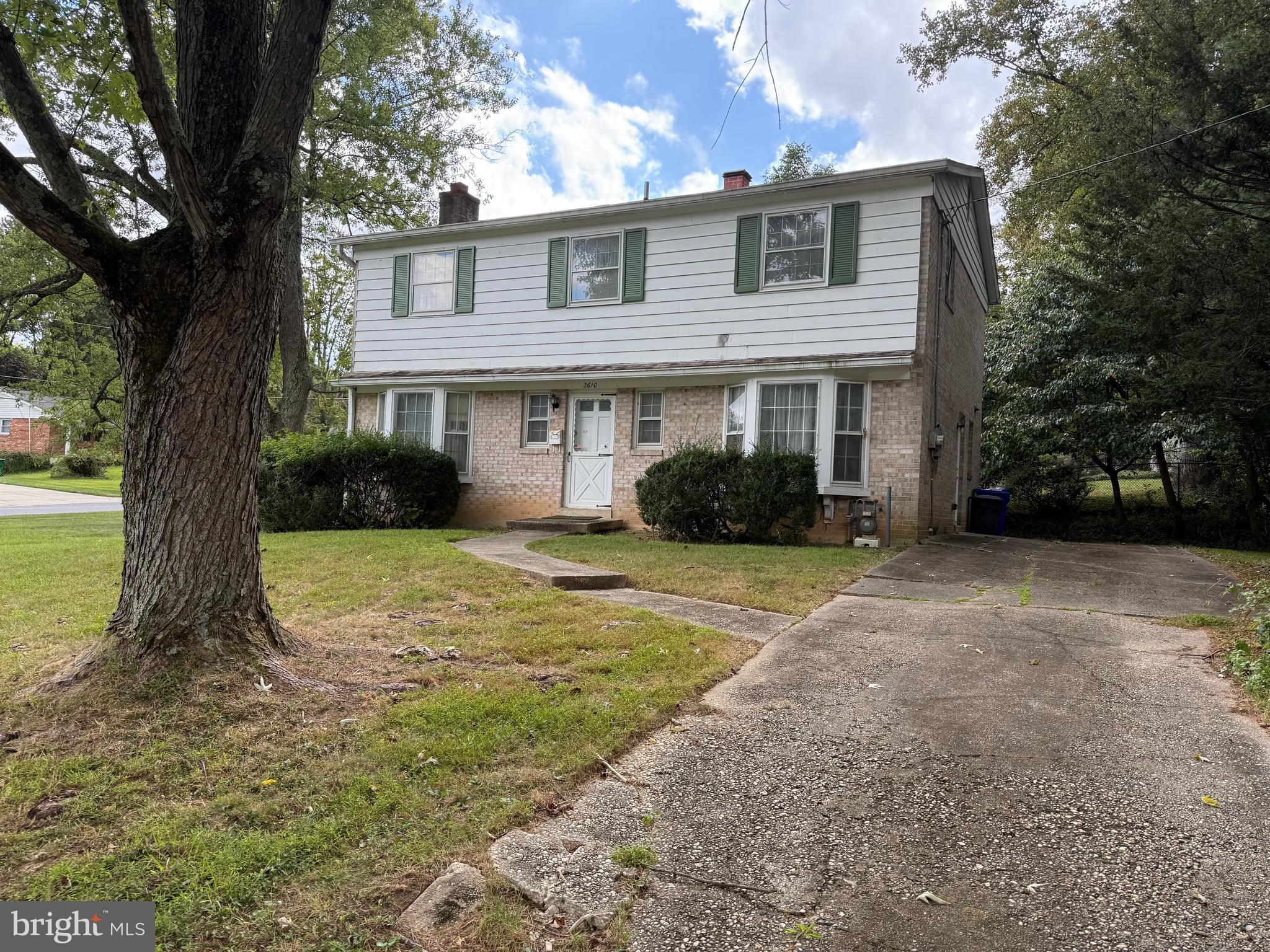 2610 Silverdale Drive Silver Spring, MD 20906 - Photo 2 of 5 a front view of a house with garden