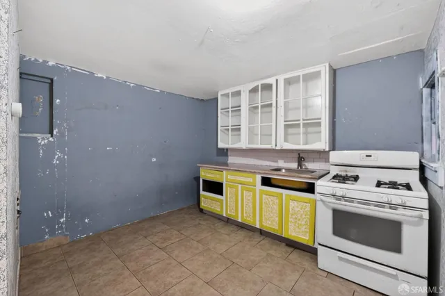 a kitchen with a stove and a sink