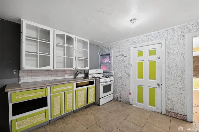 a kitchen with a stove and a microwave