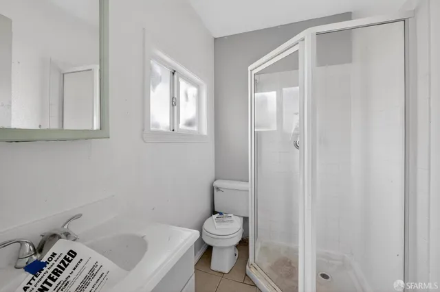 a bathroom with a toilet a sink and a bathtub
