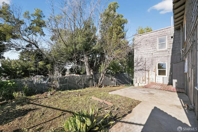 a outside view of a house with a yard
