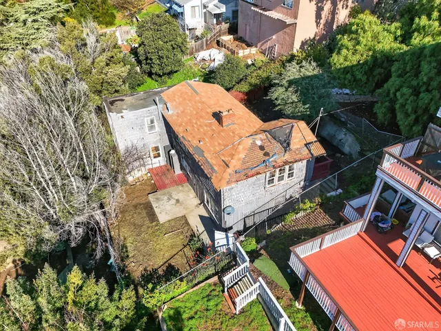 an aerial view of a house with a garden