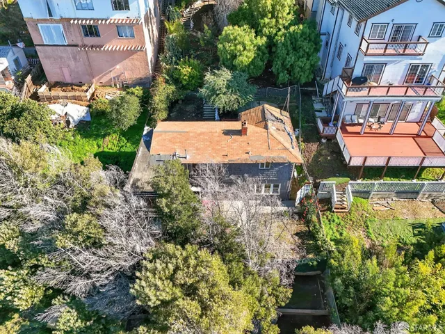 an aerial view of a house with a lake view