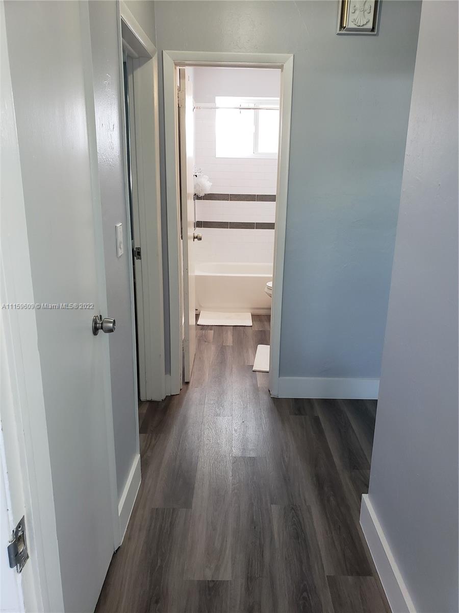 326 Southeast 3rd Terrace Dania Beach, FL 33004 - Photo 16 of 29 a view of a room with wooden floor