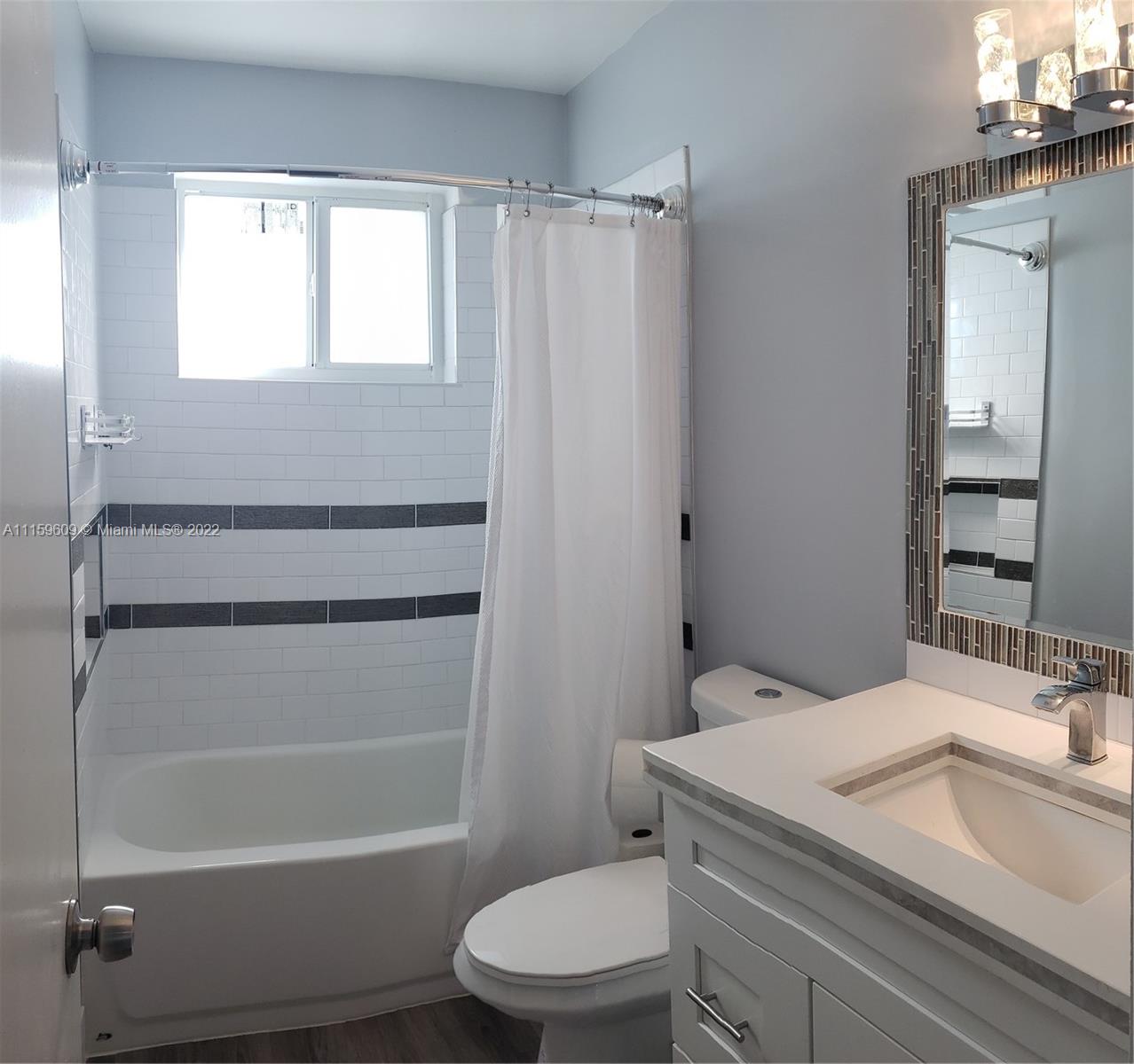 326 Southeast 3rd Terrace Dania Beach, FL 33004 - Photo 17 of 29 a bathroom with a sink toilet and shower