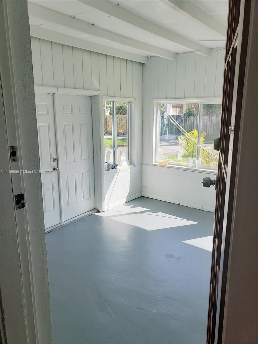 326 Southeast 3rd Terrace Dania Beach, FL 33004 - Photo 19 of 29 a view of an empty room with a window