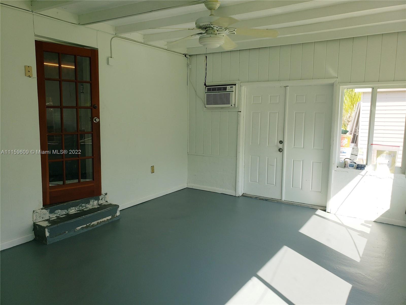 326 Southeast 3rd Terrace Dania Beach, FL 33004 - Photo 20 of 29 an empty room with windows