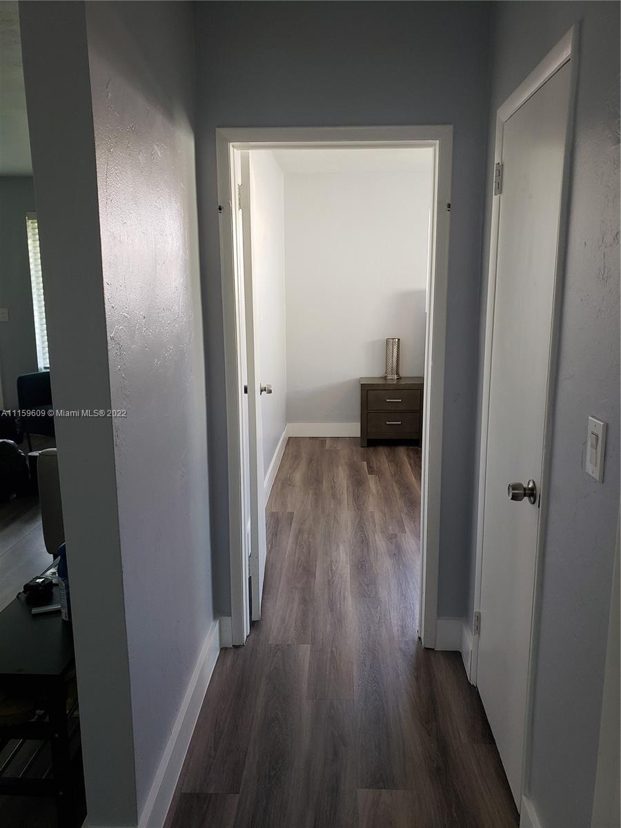 326 Southeast 3rd Terrace Dania Beach, FL 33004 - Photo 25 of 29 a view of a room with wooden floor