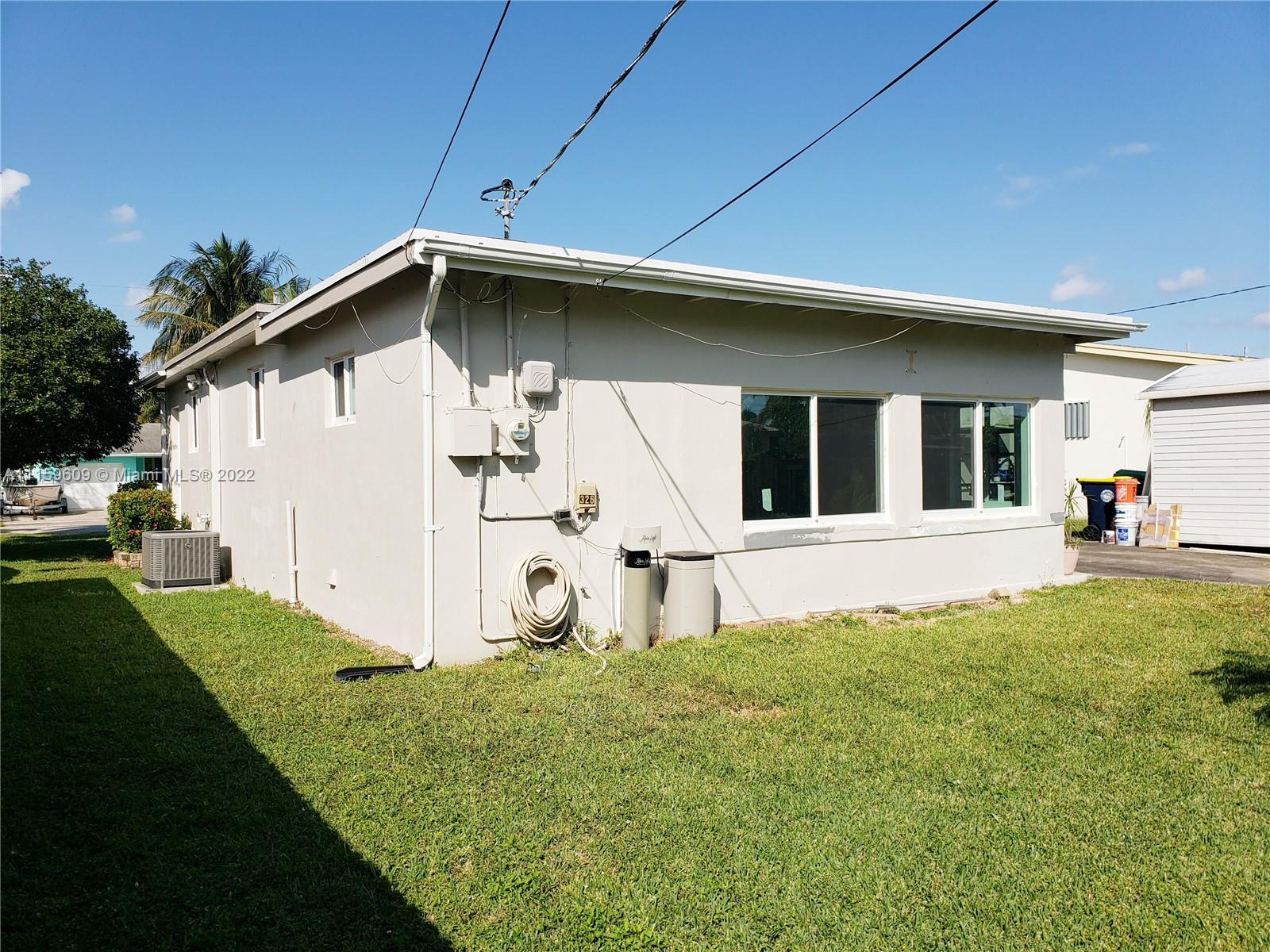 326 Southeast 3rd Terrace Dania Beach, FL 33004 - Photo 27 of 29 a view of a house with backyard