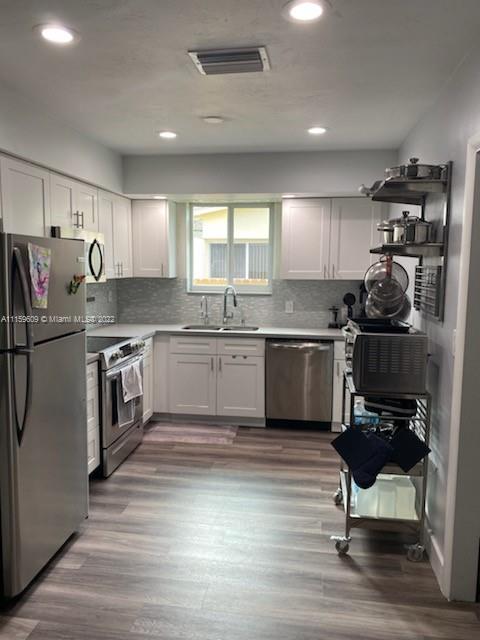 326 Southeast 3rd Terrace Dania Beach, FL 33004 - Photo 7 of 29 a kitchen with a stove a sink and a refrigerator