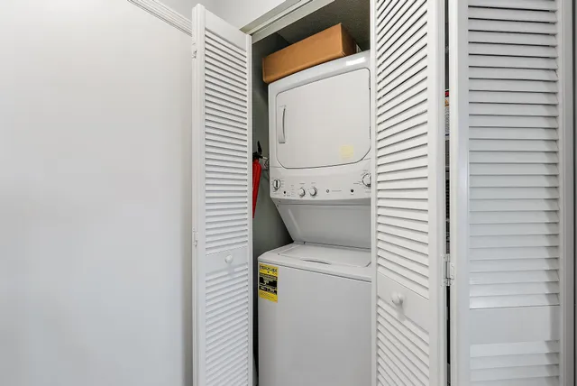 a view of bathroom with a washer and dryer