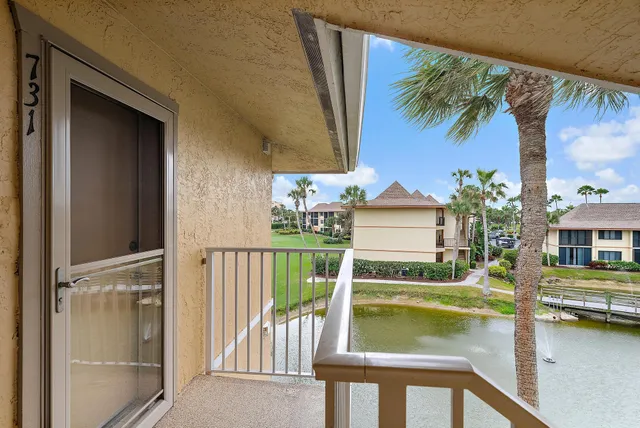 a view of swimming pool with a house in the background