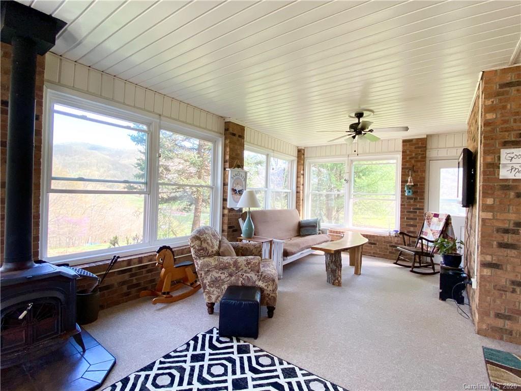 27 Morgan Branch Road Leicester, NC 28748 - Photo 14 of 39 a living room with furniture and large windows
