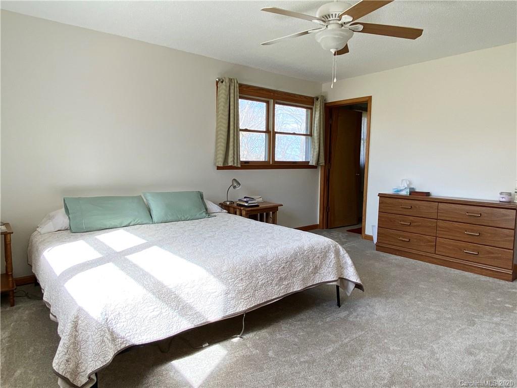 27 Morgan Branch Road Leicester, NC 28748 - Photo 16 of 39 a bedroom with a bed and window