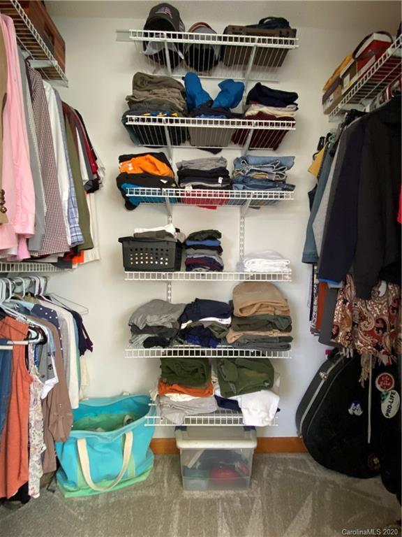 27 Morgan Branch Road Leicester, NC 28748 - Photo 19 of 39 a store room with lots of different colored cloths