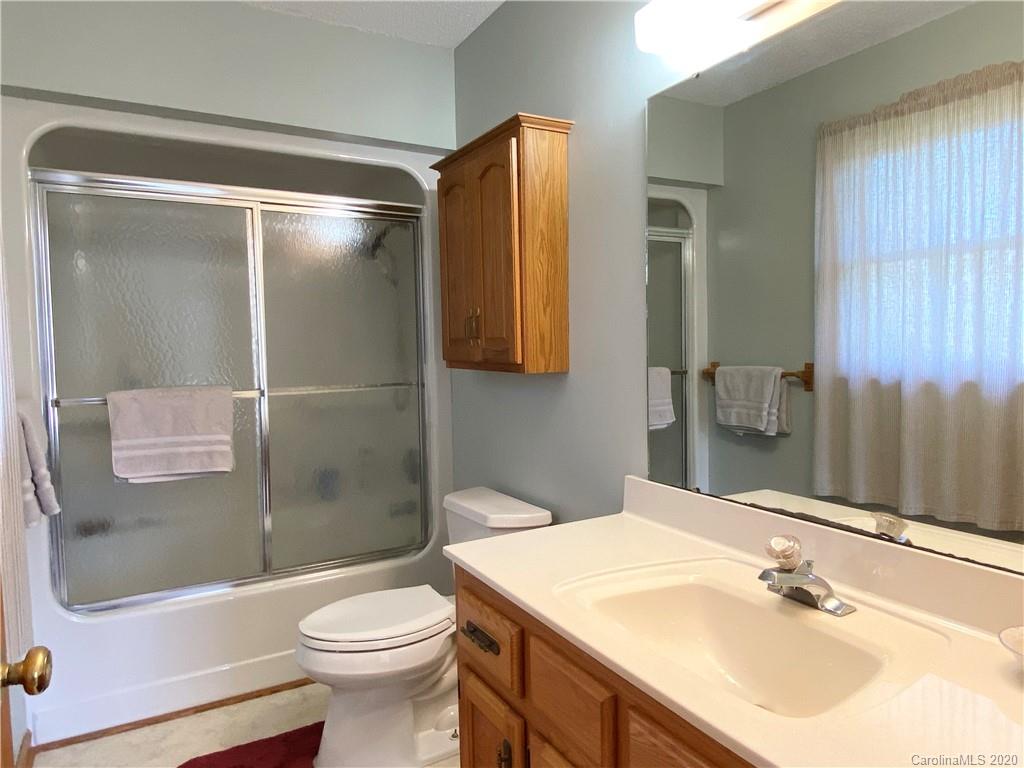27 Morgan Branch Road Leicester, NC 28748 - Photo 20 of 39 a bathroom with a sink toilet and shower