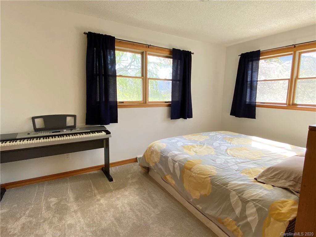 27 Morgan Branch Road Leicester, NC 28748 - Photo 21 of 39 a bedroom with a bed and window