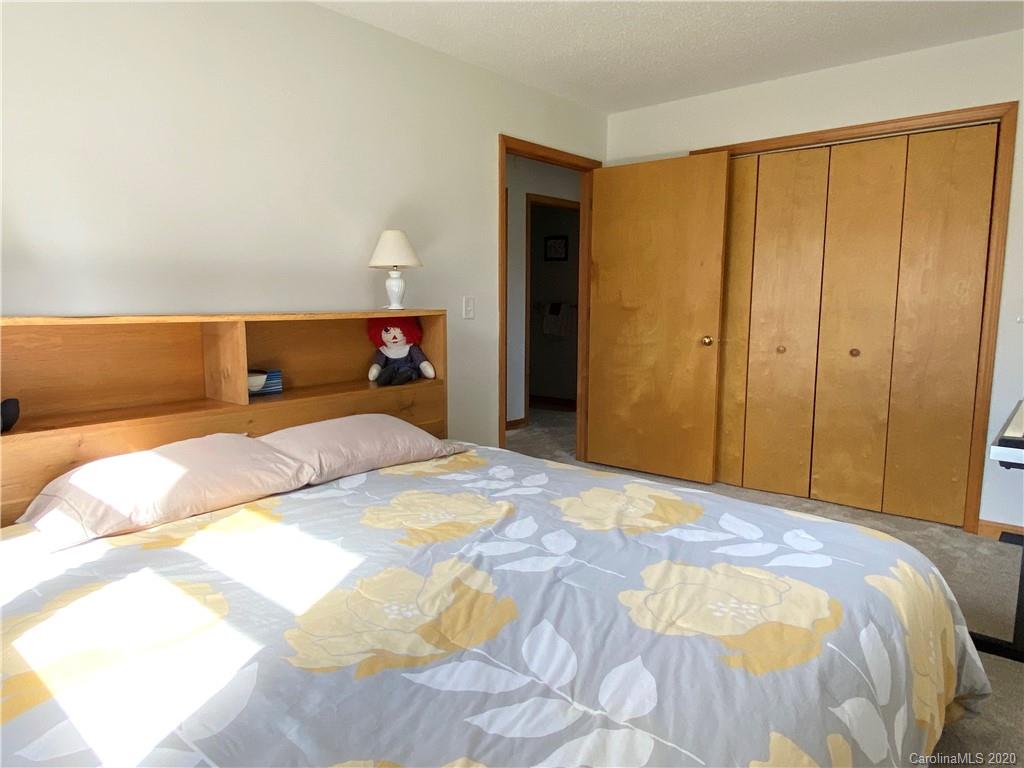 27 Morgan Branch Road Leicester, NC 28748 - Photo 23 of 39 a bedroom with a bed and a closet