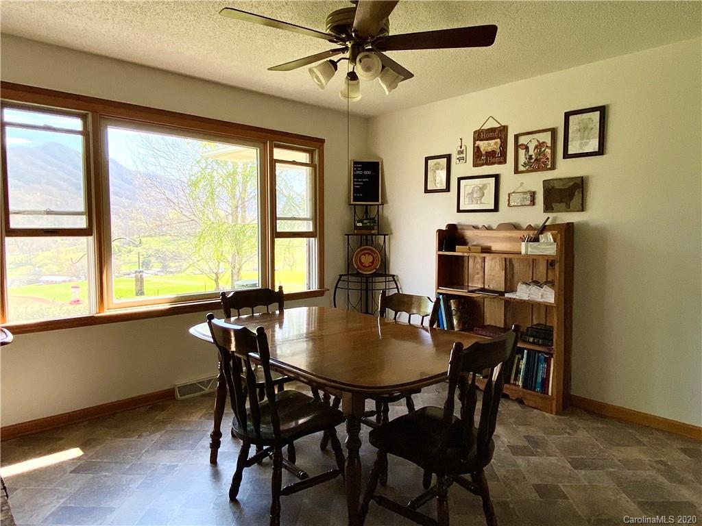 27 Morgan Branch Road Leicester, NC 28748 - Photo 7 of 39 a view of a dining room with furniture window and wooden floor