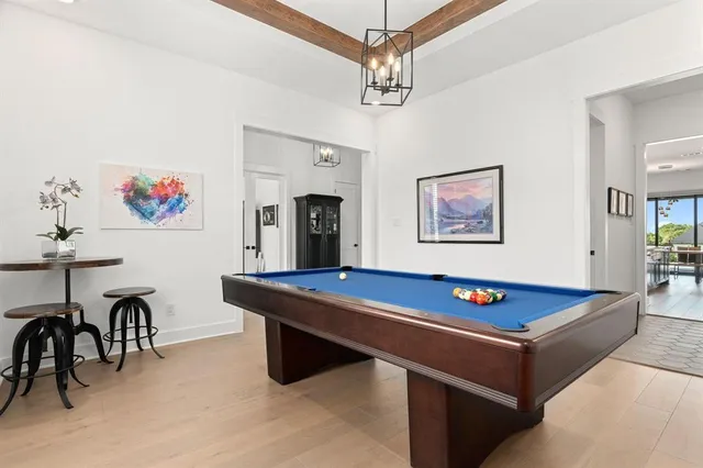 a room with furniture and paintings on the wall