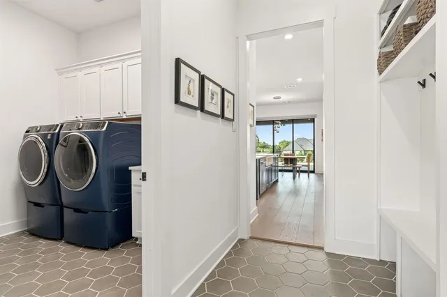 a view of a hallway with washer and dryer