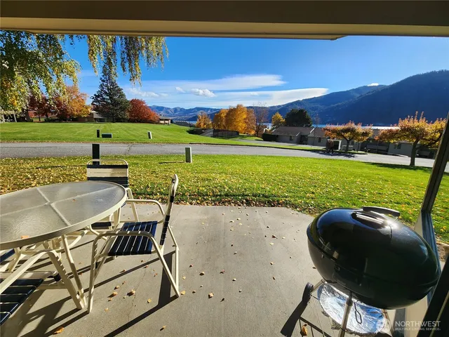 a view of a swimming pool and lounge chairs