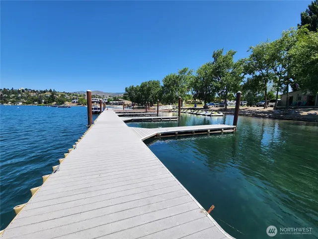 a swimming pool view with a lake view