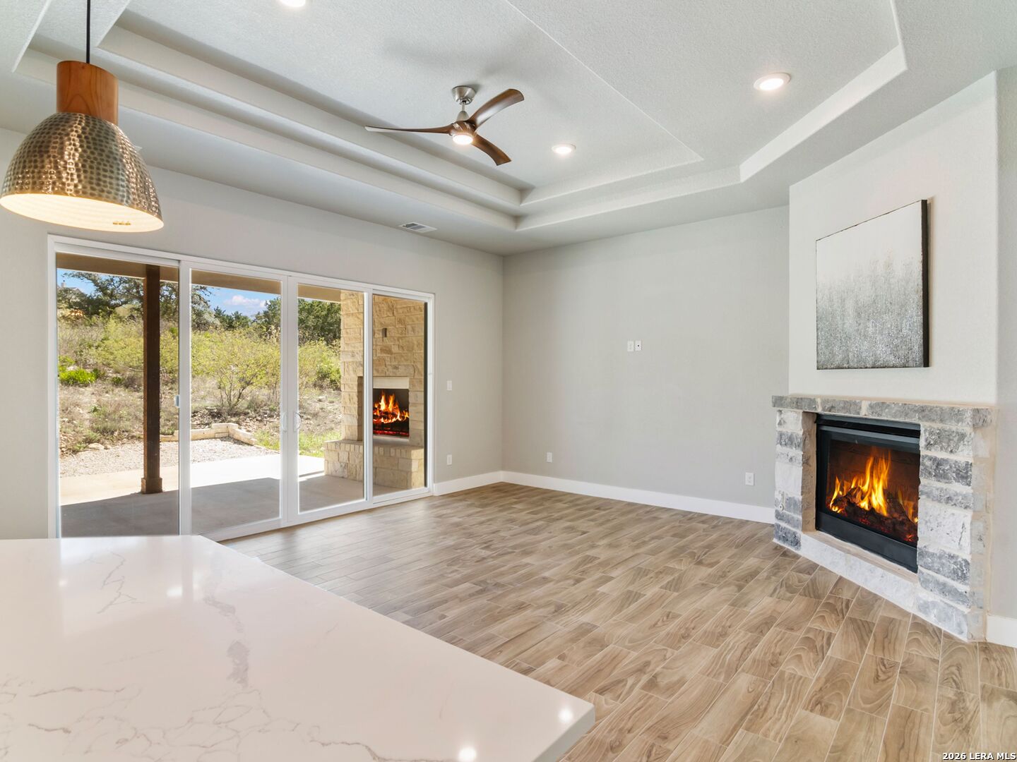 250 Private Road 2775 Mico, TX 78056 - Photo 12 of 57 a view of an empty room with a fireplace and a window