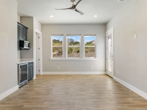 a spacious bathroom with a sink mirror and a bathtub