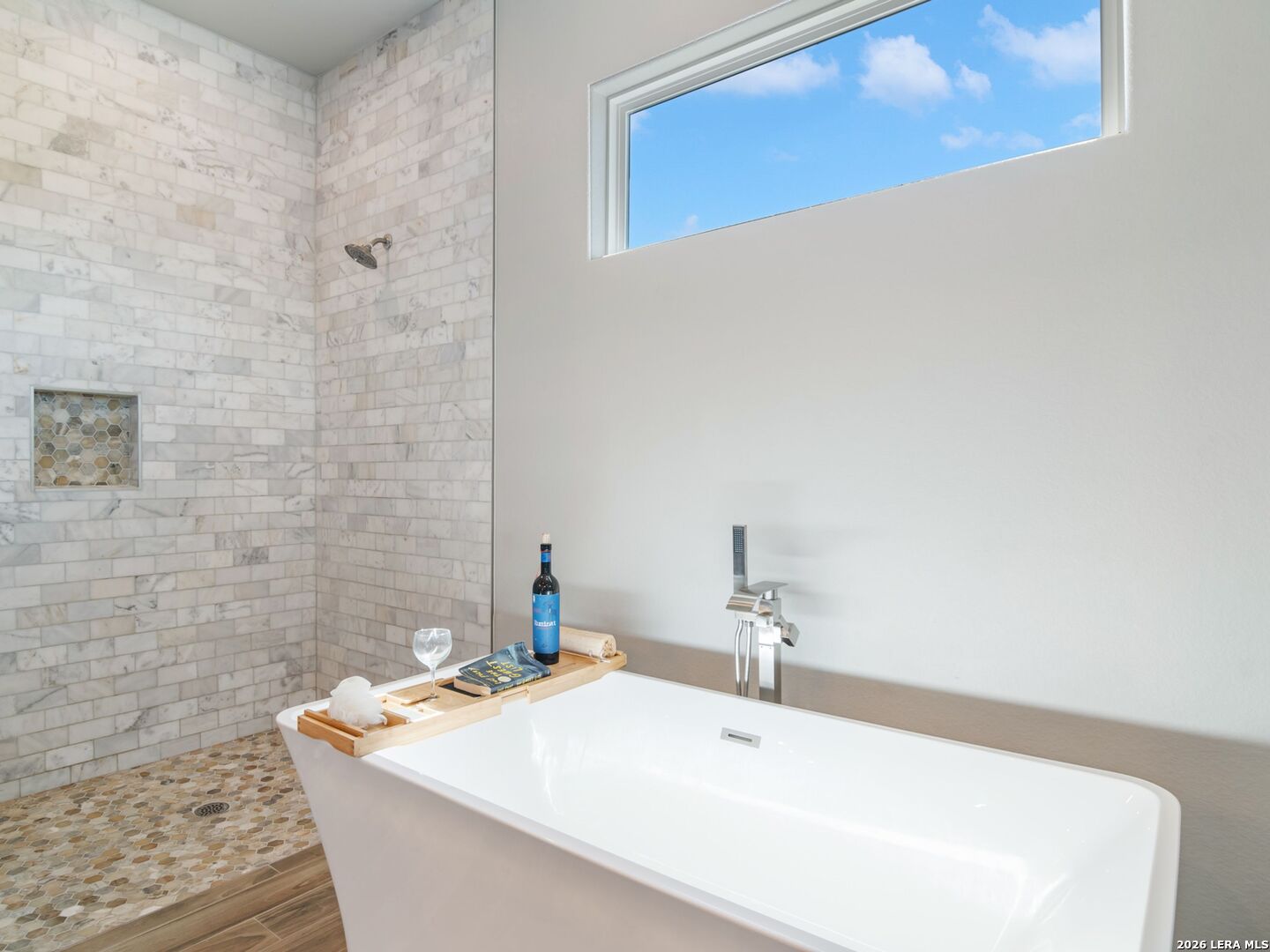 250 Private Road 2775 Mico, TX 78056 - Photo 33 of 57 a bathroom with a sink a mirror and a bathtub