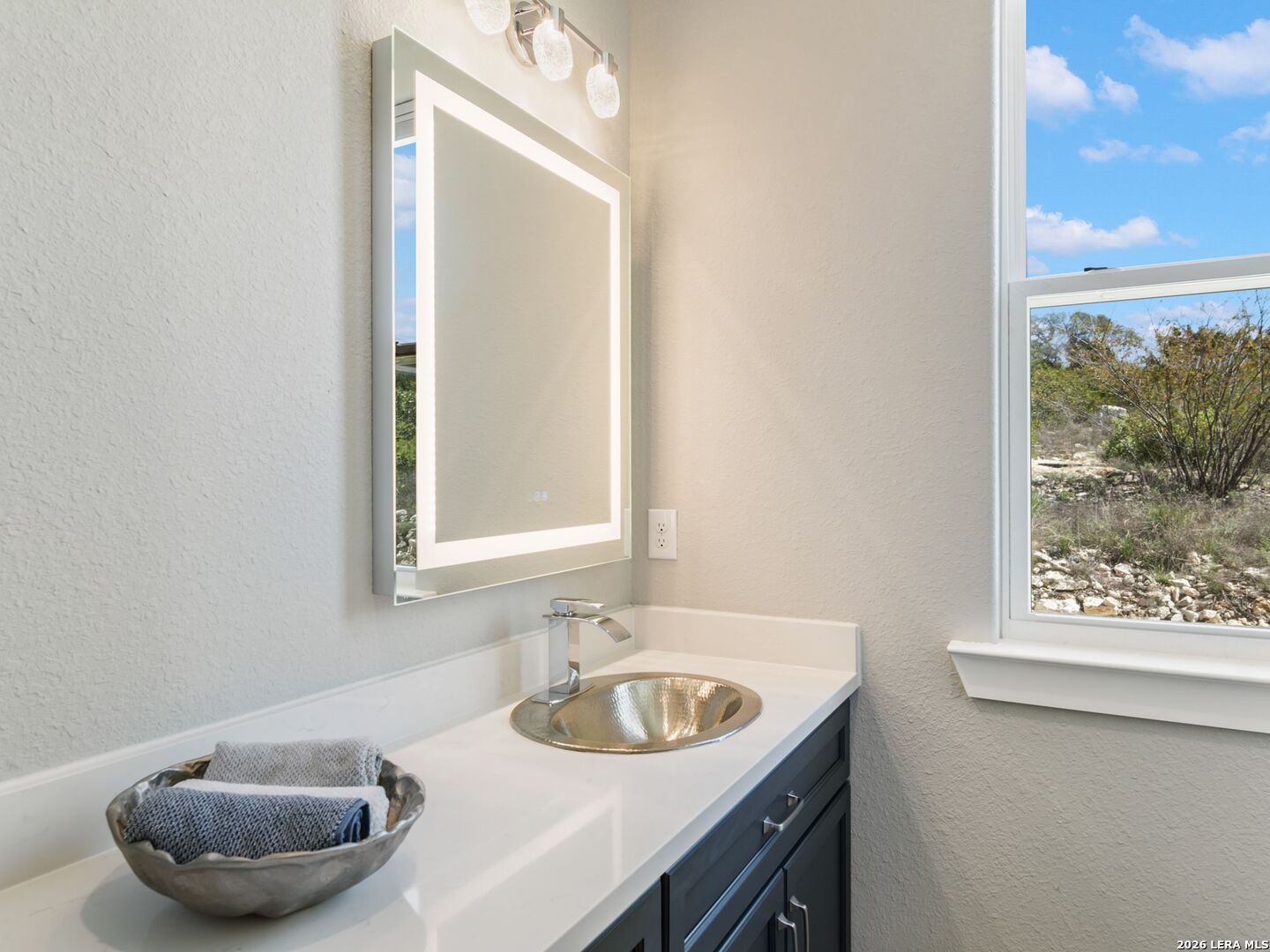 250 Private Road 2775 Mico, TX 78056 - Photo 36 of 57 a bathroom with a sink and a mirror