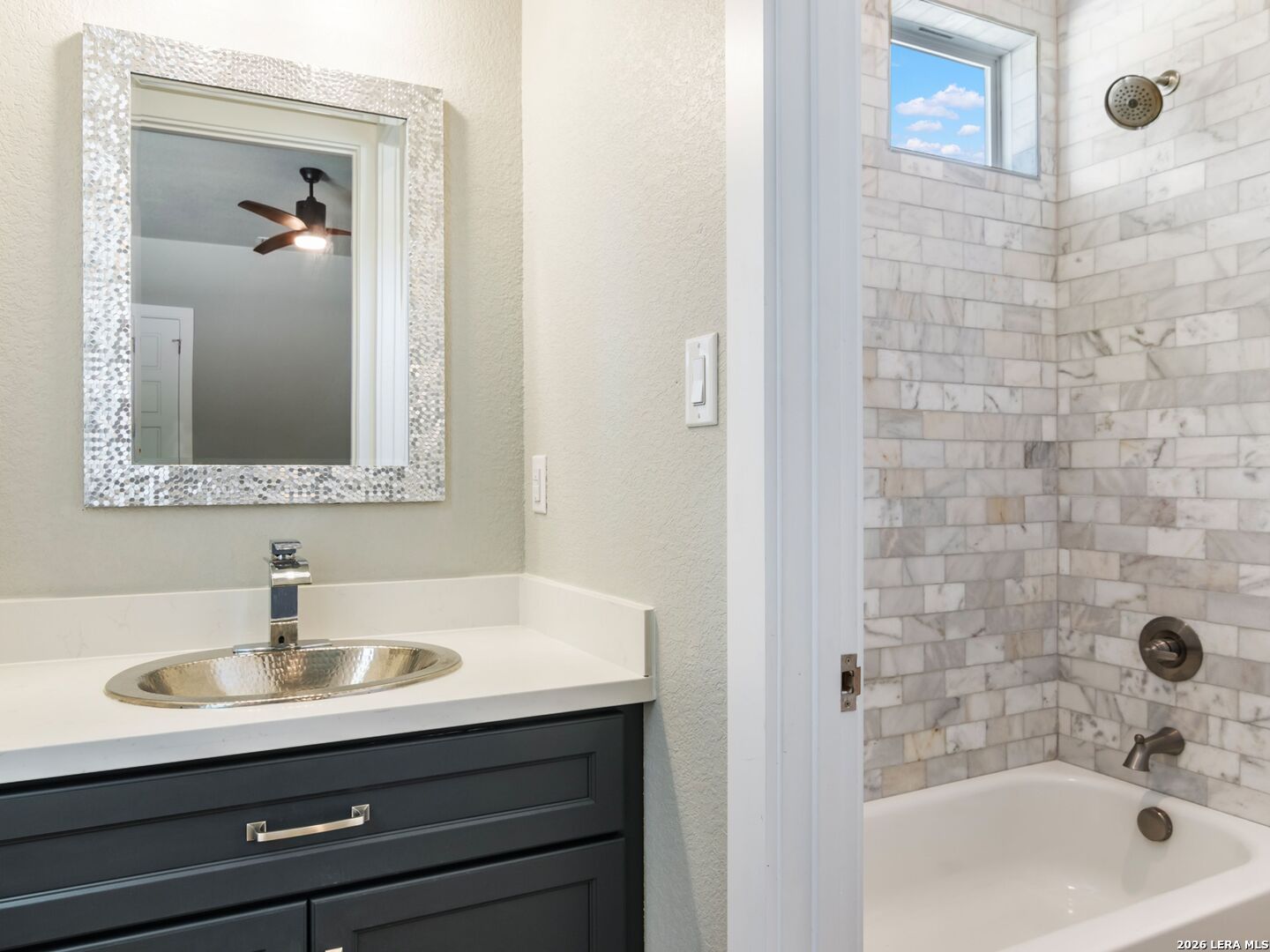 250 Private Road 2775 Mico, TX 78056 - Photo 41 of 57 a bathroom with a sink a tub and a mirror