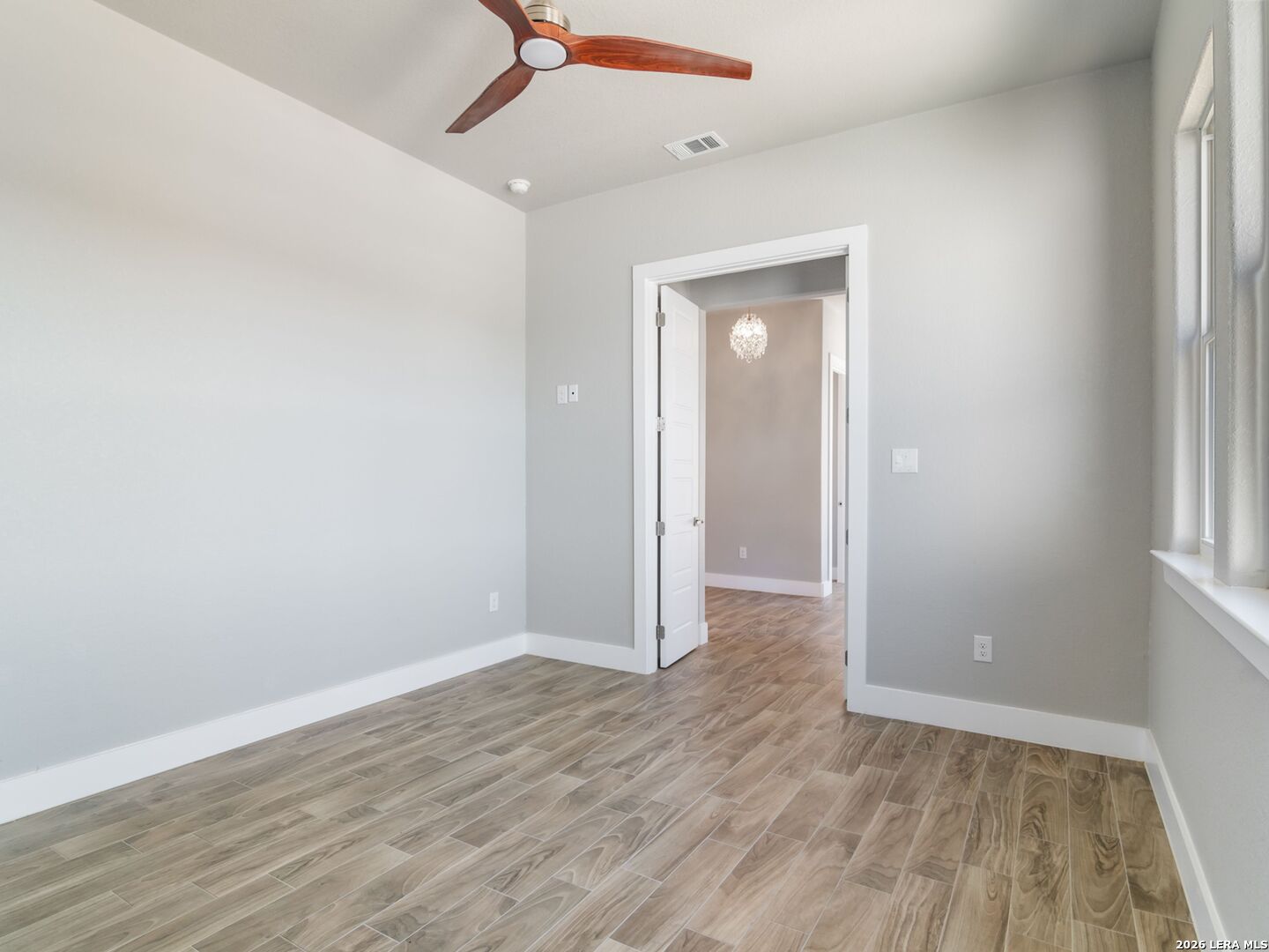 250 Private Road 2775 Mico, TX 78056 - Photo 43 of 57 wooden floor in an empty room with a window