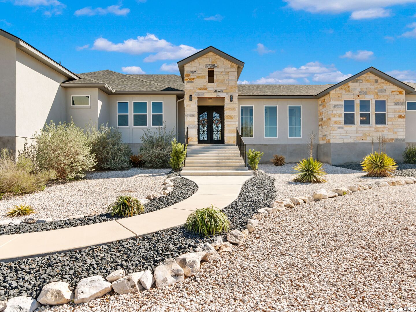 250 Private Road 2775 Mico, TX 78056 - Photo 5 of 57 a front view of a house with a yard