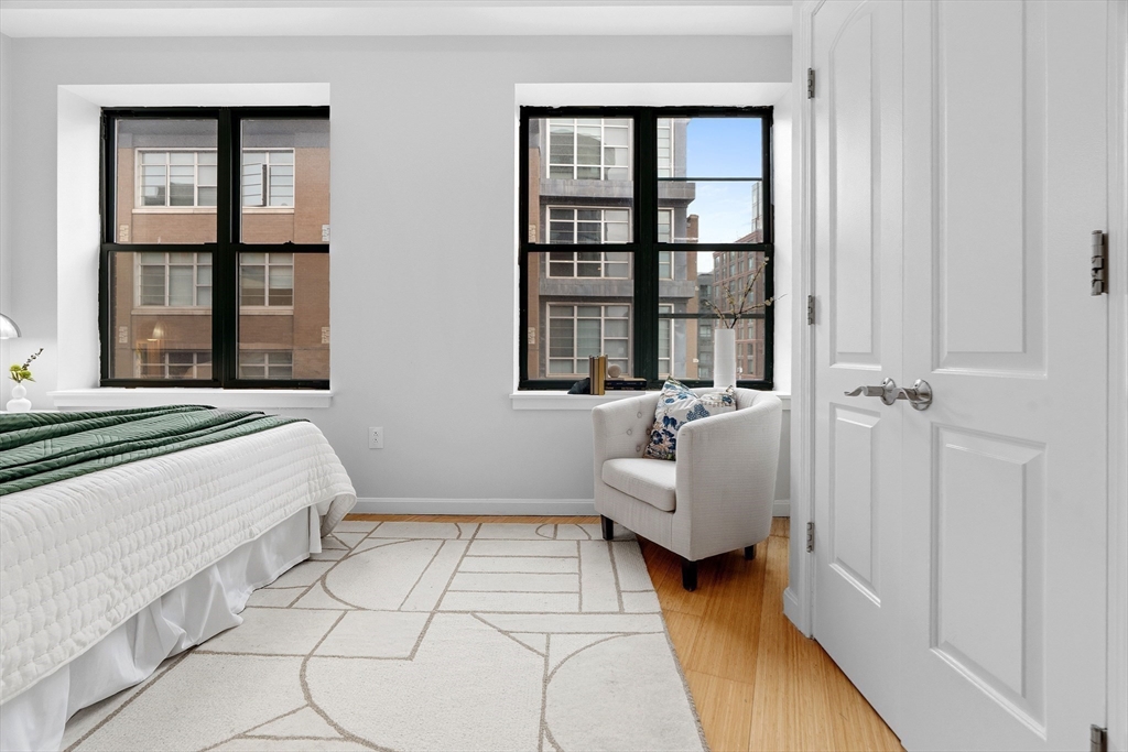 40 Fay Street, Unit 406 Boston, MA 02118 - Photo 10 of 19 a bedroom with furniture and a window
