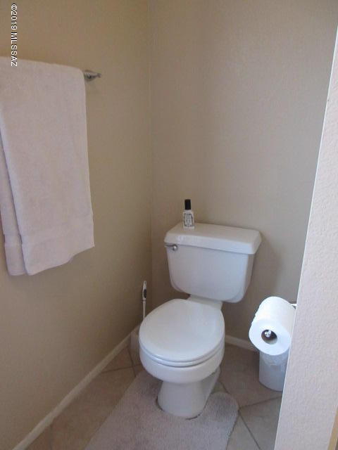 1022 Via Independencia Rio Rico, AZ 85648 - Photo 31 of 41 a white toilet sitting next to a white sink