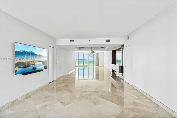 a view of livingroom with furniture and floor to ceiling window