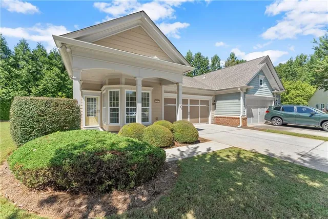 front view of a house with a yard