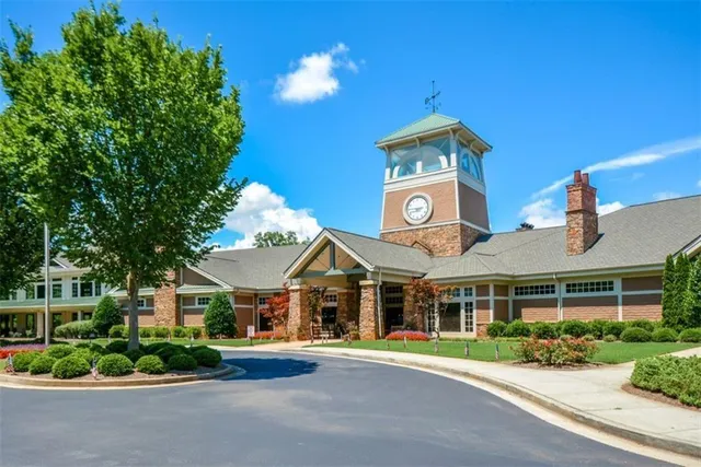 an aerial view of a house with yard swimming pool and outdoor seating