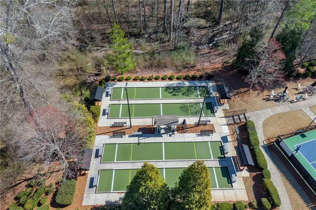 a view of swimming pool with outdoor seating and plants
