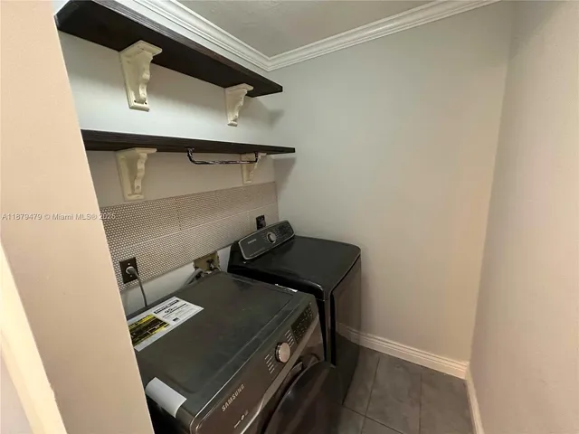 a view of staircase with railing and a chandelier