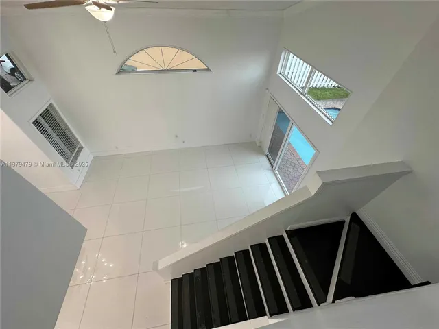 a bathroom with a sink toilet mirror and bathtub