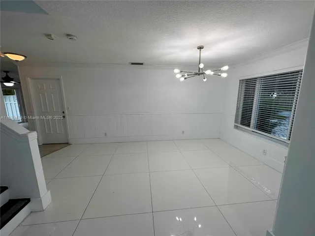 a view of entryway with stairs and wooden floor