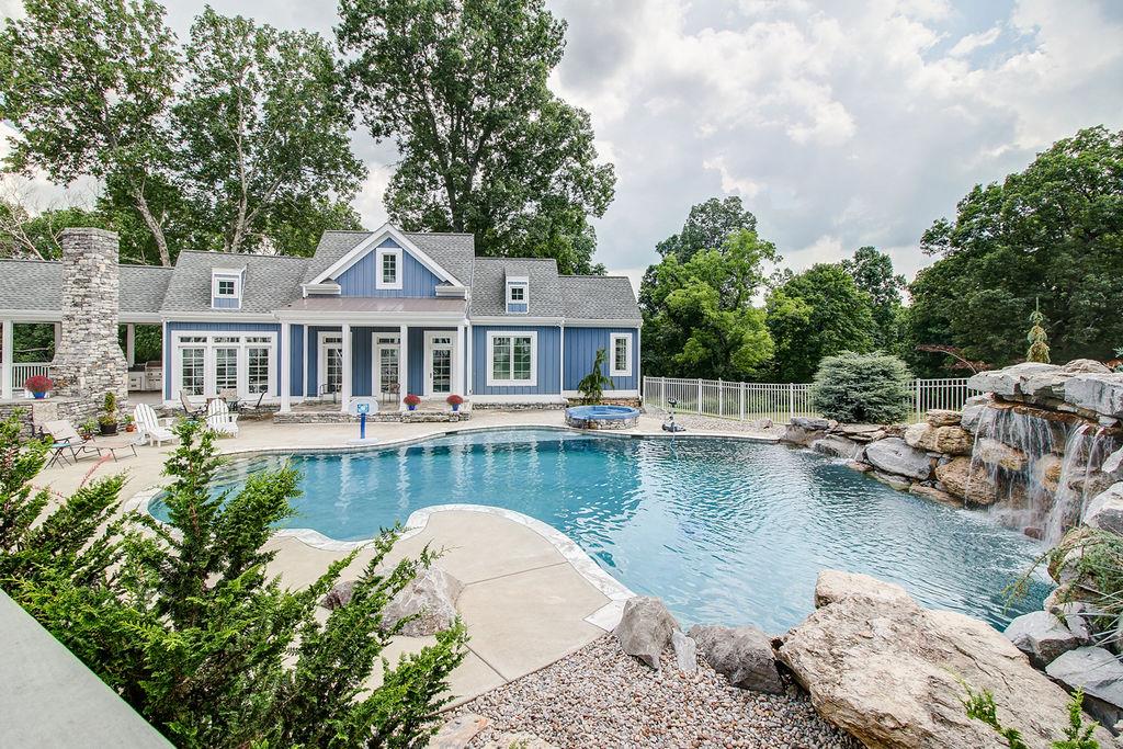 4304 Clarence Murphy Road Springfield, TN 37172 - Photo 17 of 30 a view of a house with pool plants and large trees