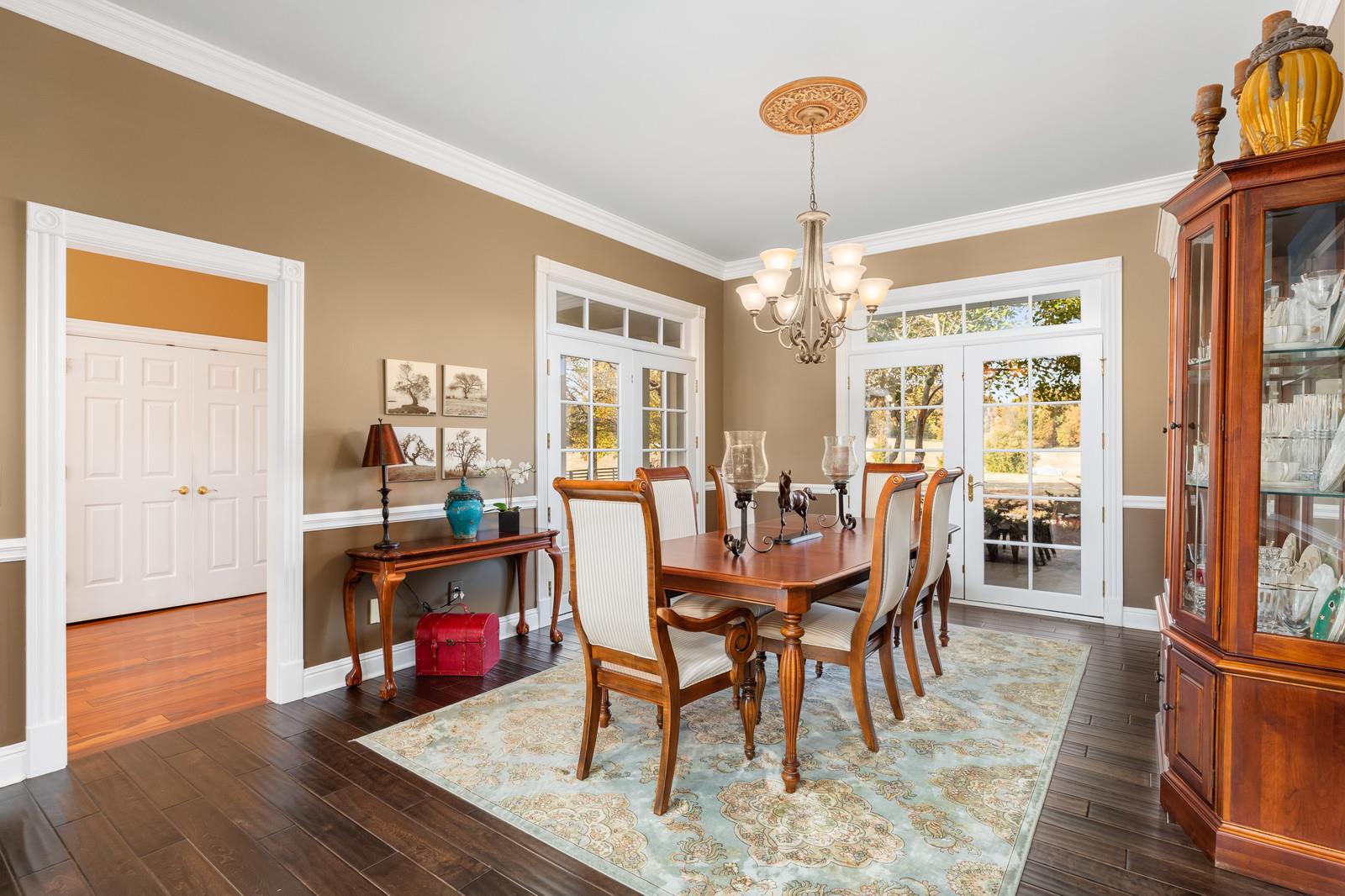 4304 Clarence Murphy Road Springfield, TN 37172 - Photo 10 of 30 a dining room with furniture a chandelier and wooden floor
