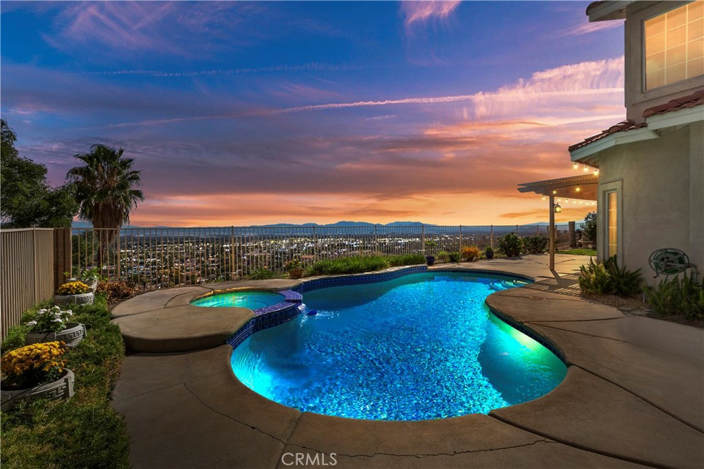 a view of a swimming pool with lounge chair