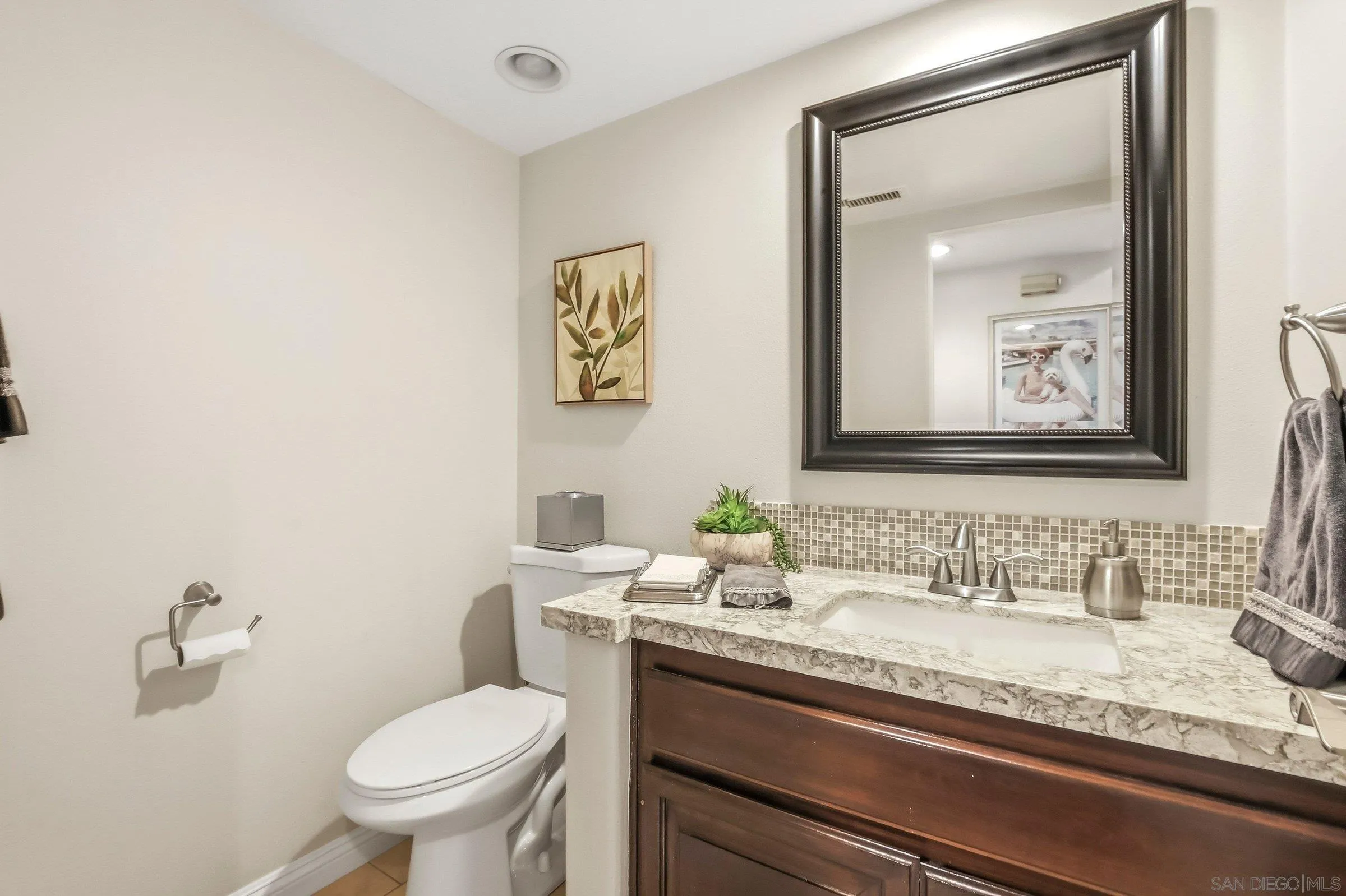 52 Spinnaker Way Coronado, CA 92118 - Photo 16 of 45 a bathroom with a granite countertop sink mirror and toilet